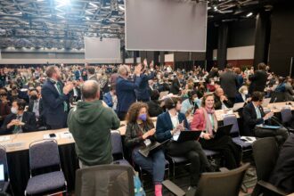 Delegates applaud after reaching an agreement during the plenary for the tail end of the United Nations Biodiversity Conference (COP15) in Montreal, Quebec, Canada on Dec. 19, 2022. Credit: Andrej Ivanov/ AFP via Getty Images