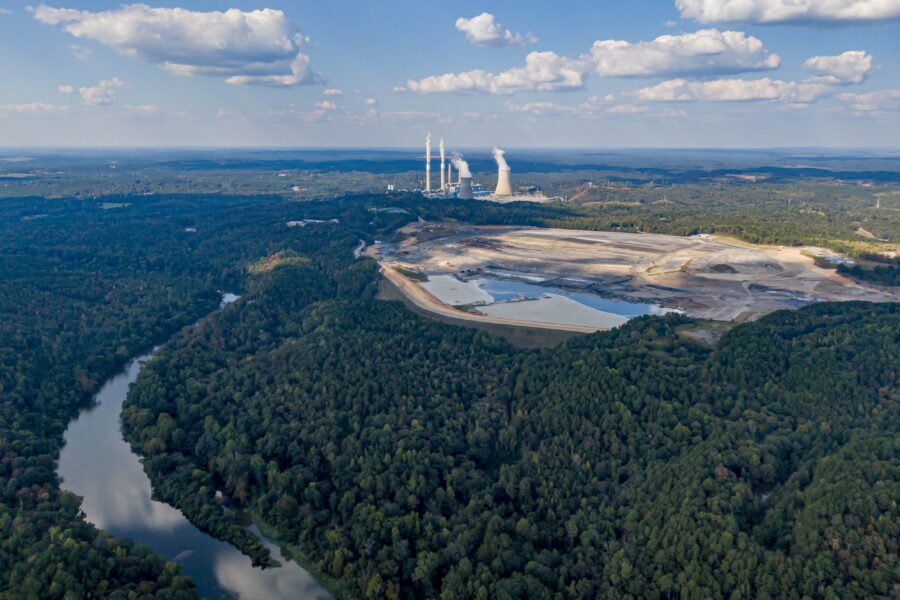 A coal ash pond (center) located near the Locust Fork of the Black Warrior River (foreground) at Alabama Power's Plant Miller (background) in western Jefferson County, Alabama. Credit: Lee Hedgepeth/Inside Climate News