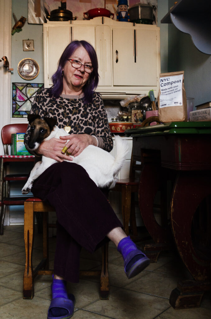 Liz French and Screamin’ Nini sit in her kitchen in Ridgewood, Queens. Credit: Jake Bolster