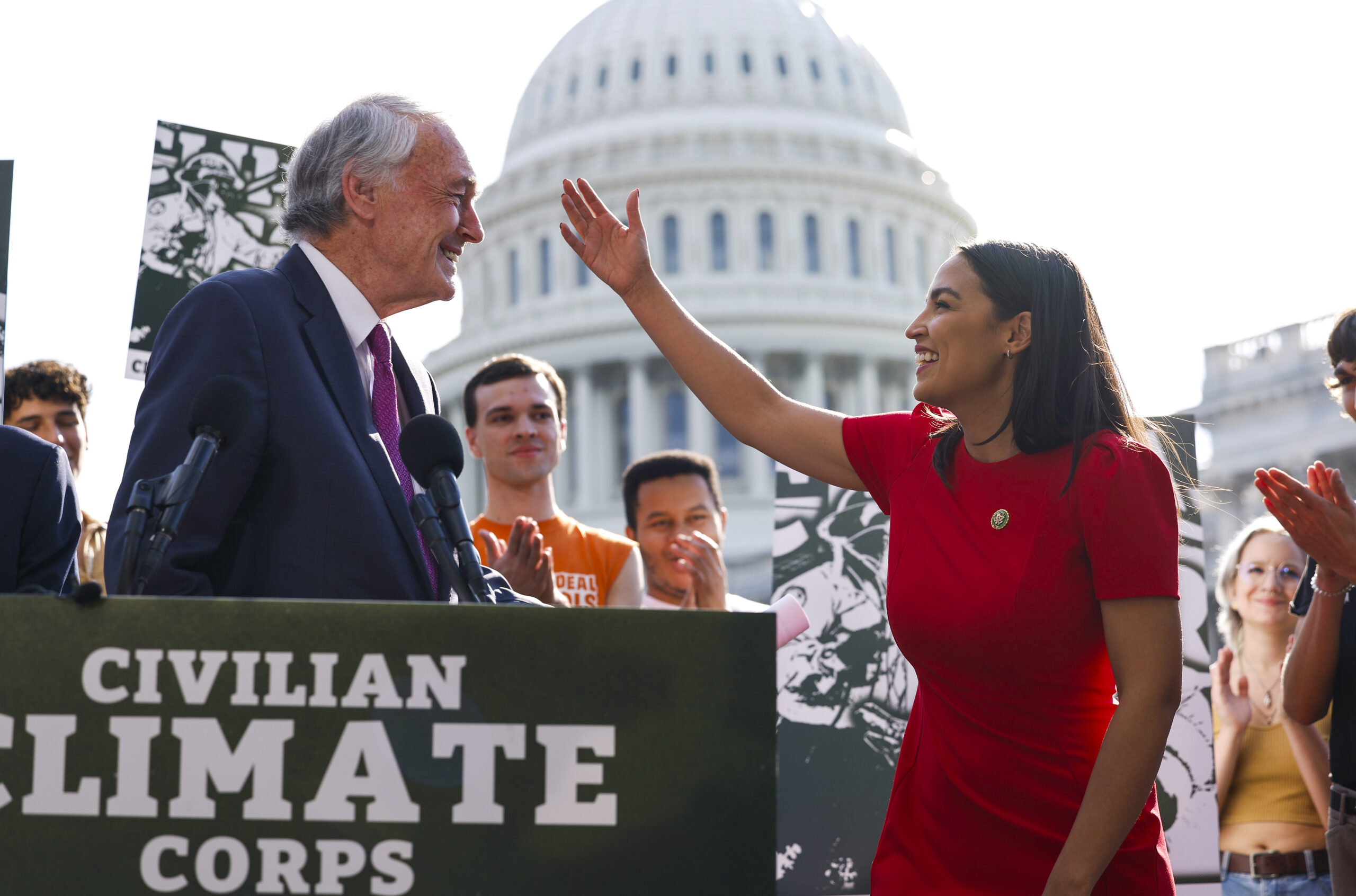 Rep. Alexandria Ocasio-Cortez (D-NY) hugs Sen. Ed Markey (D-MA) as they speak at a news conference in September 2023 on the launch of the American Climate Corps outside the U.S. Capitol. Credit: Anna Moneymaker/Getty Images.
