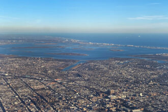 An aerial view over Brooklyn and the Rockaways, near Jamaica Bay. The tentative U.S. Army Corps of Engineers' coastal storm surge plan calls for one storm gate to be constructed at the entrance to Jamaica Bay. Credit: Lindsey Nicholson/UCG/Universal Images Group via Getty Images.