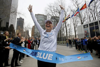 Australian water scarcity activist Mina Guli completes her 200th marathon outside UN headquarters, ahead the UN Water Conference, on March 22, 2023, in New York City. Credit: Leonardo Munoz/AFP via Getty Images.
