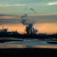 The smokestacks of Dow and other petrochemical plants dominate the skyline in the lower Brazos River watershed around Freeport, Texas. Credit: Meridith Kohut for The Texas Observer.