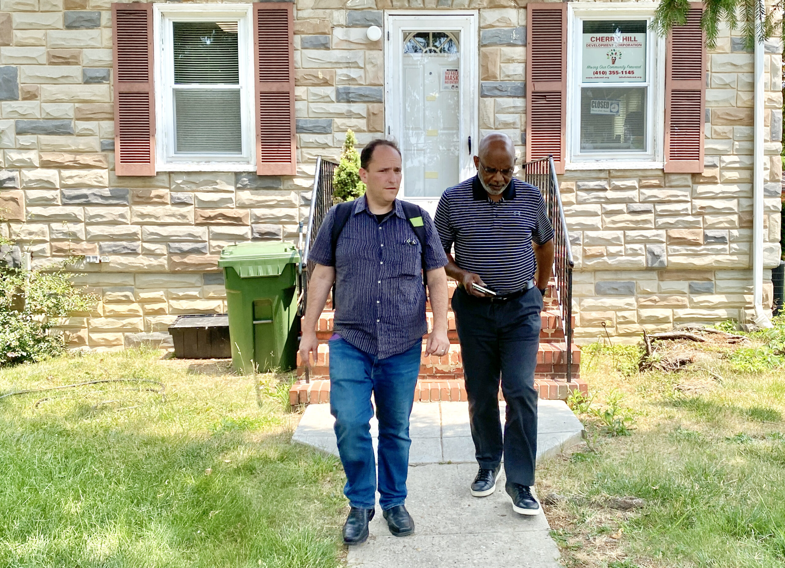 Brad Rogers, left, and Rev. Richard Partlow, the interim executive director of Cherry Hill Development Corporation, one of the community partners of the South Baltimore Gateway Partnership, on their way to a meeting at the Cherry Hill Strong's office nearby. Credit: Aman Azhar / Inside Climate News