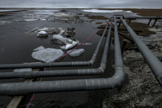 Pipelines extend across the landscape outside Nuiqsut, Alaska, 36 miles from the Willow Master Development Plan located in the National Petroleum Reserve on Alaska's North Slope. Credit: Bonnie Jo Mount/The Washington Post via Getty Images.